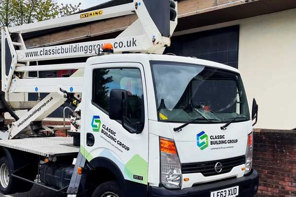 Aerial work platform truck parked outside.