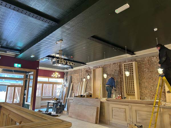 Fit-out specialists north west with joiner and electrician at work during a furbishment of a heritage commercial space manchester